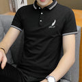 Black short sleeve polo shirt with white feather and text embroidery, casual men's fashion