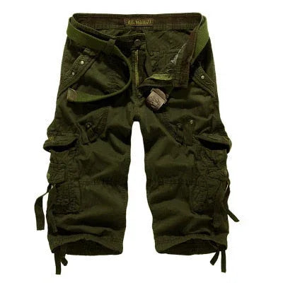 Men's green cargo shorts with multiple pockets and belt, casual outdoor style.