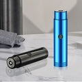 Portable rechargeable electric shaver in metallic blue and black on a marble surface