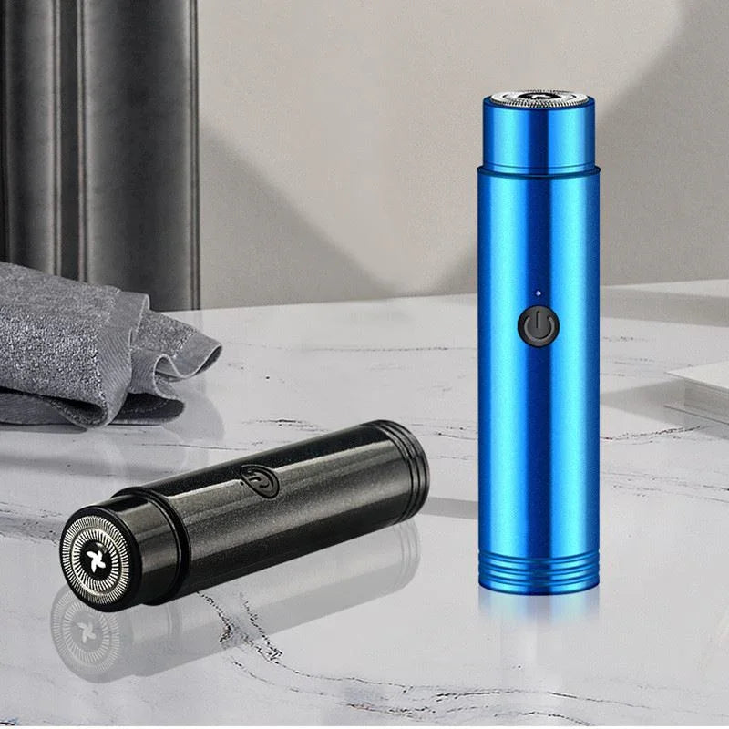 Portable rechargeable electric shaver in metallic blue and black on a marble surface