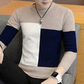 Men's colorblock knit sweater in beige, navy, and white, modern geometric design.