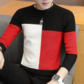 Men's color block sweater with black, red, and white geometric design, long sleeves